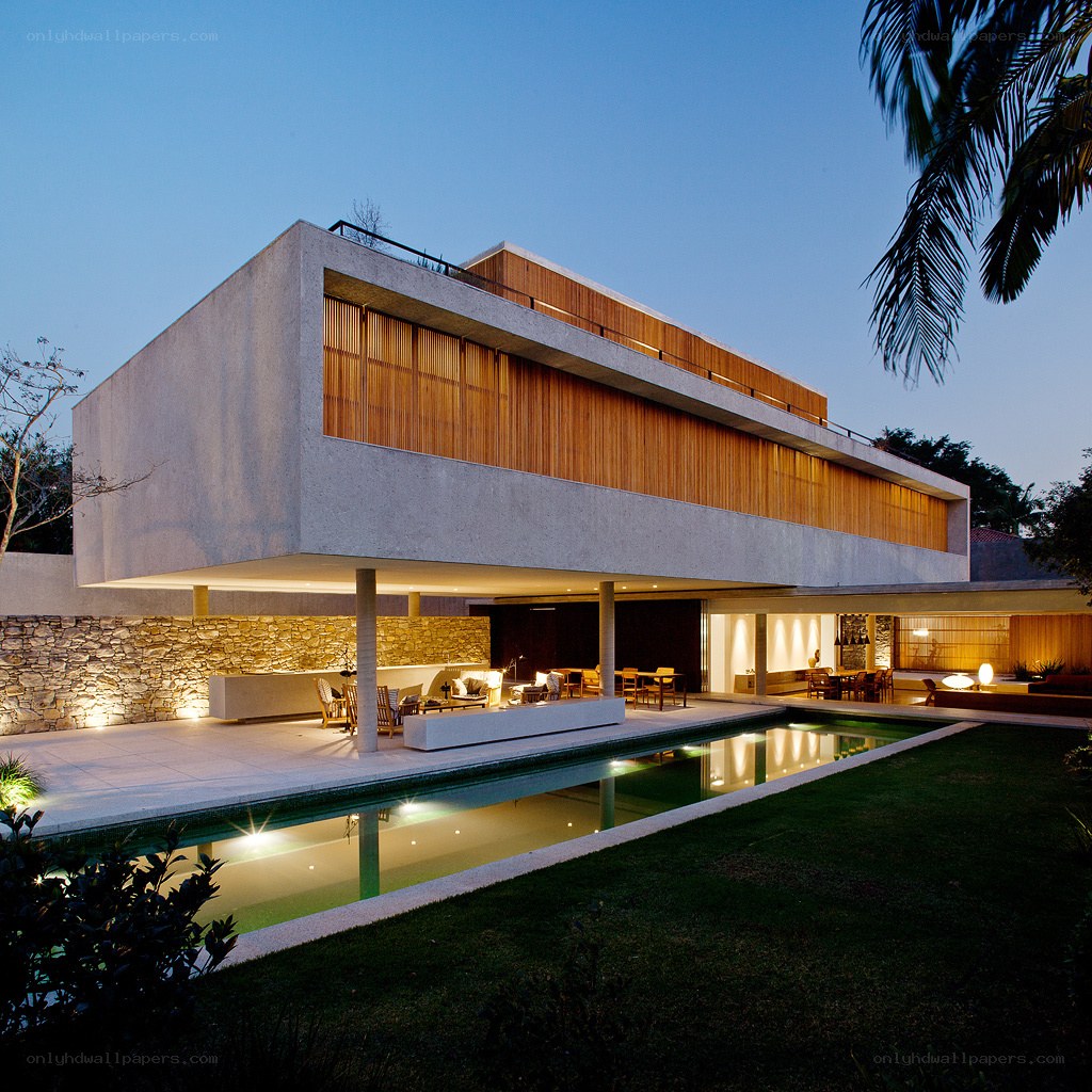 Modern house with pool at dusk