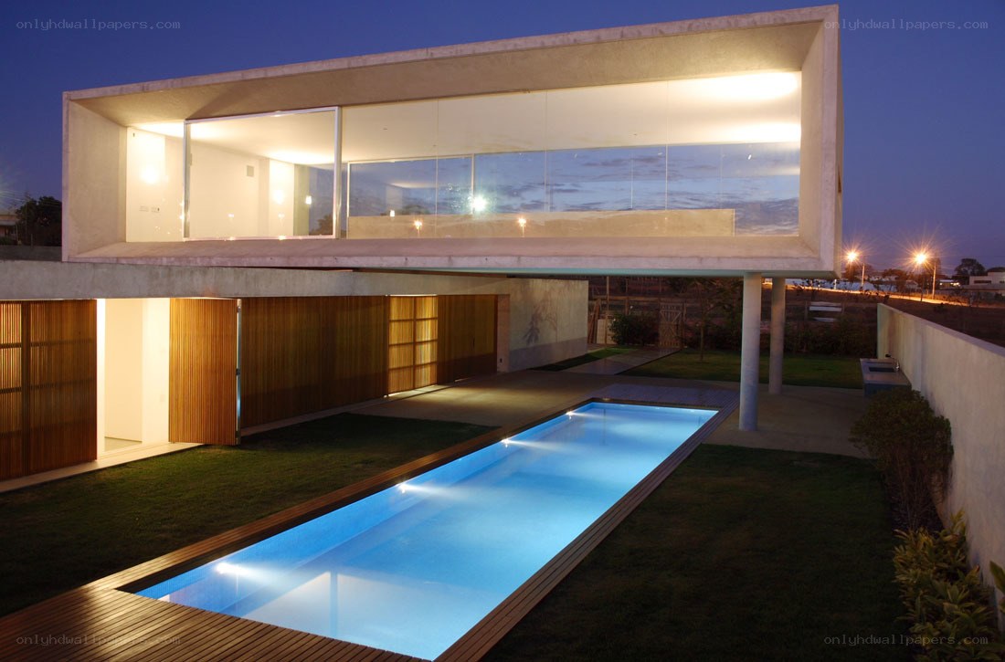 Modern house with pool at night