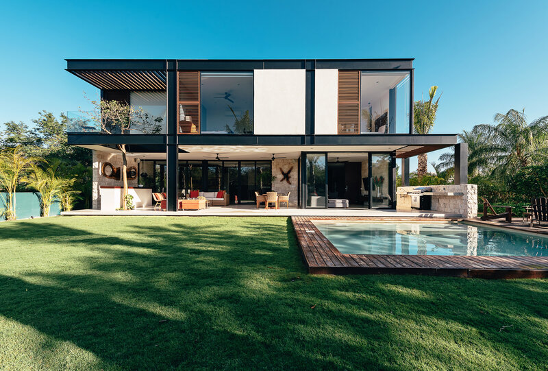 Modern House with Pool — Green, Serene, Afternoon, Photograph, Lawn, Palm Trees