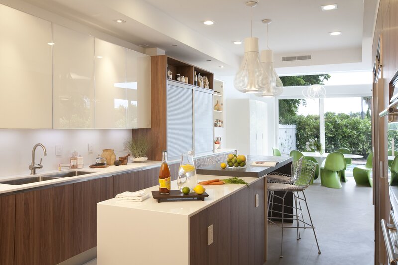 Modern kitchen with island and green chairs