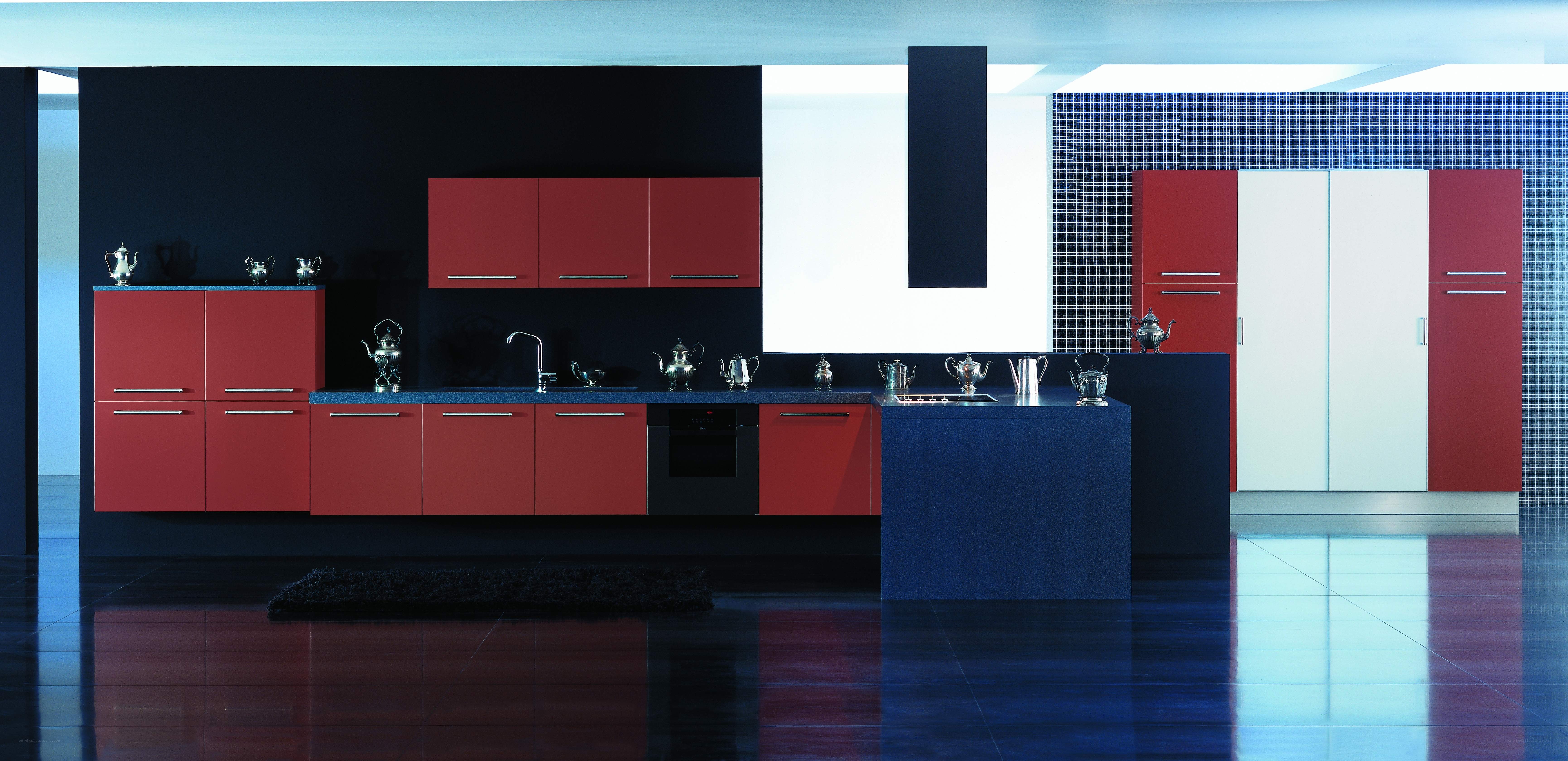 modern kitchen with red and blue cabinets