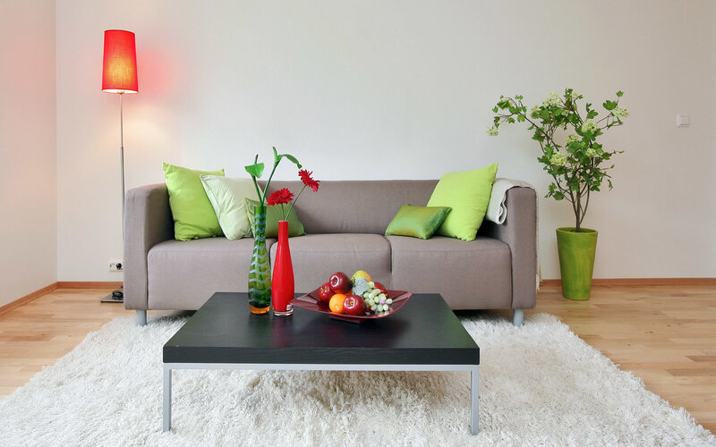 Modern living room with green accents