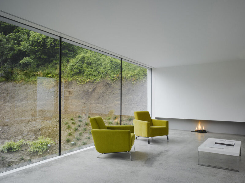 Modern living room with green chairs