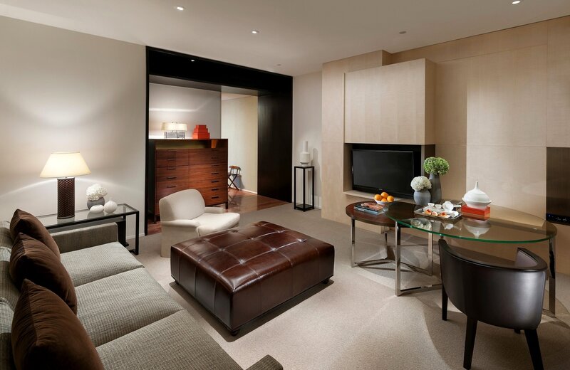 Modern living room with leather ottoman