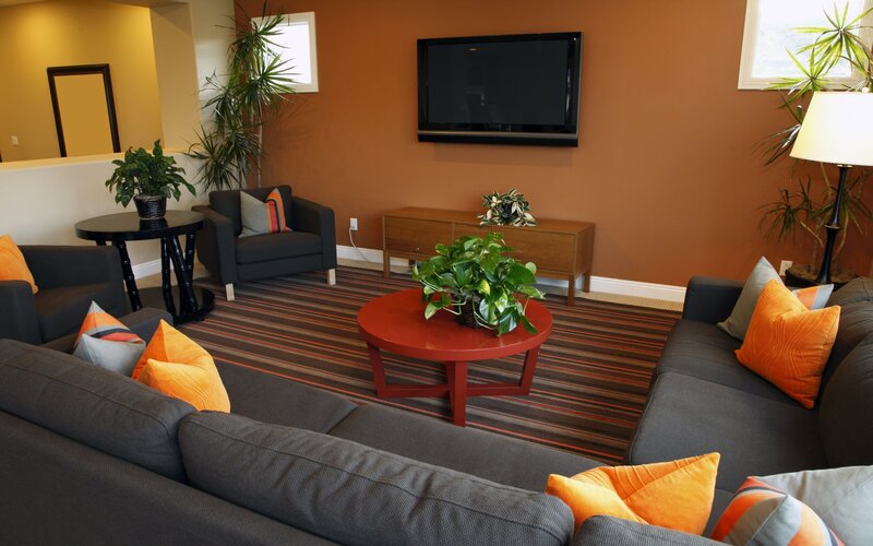 Modern living room with orange accents