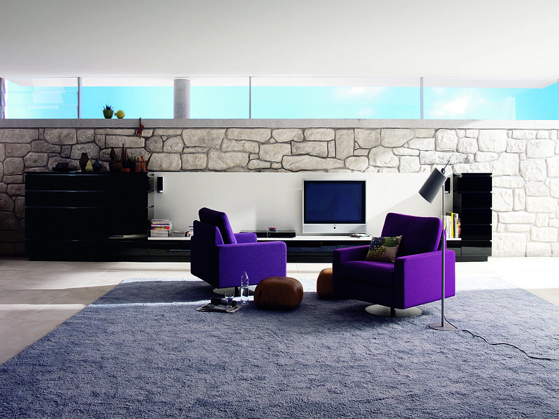 Modern living room with purple chairs