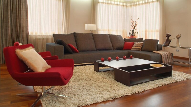 Modern living room with red armchair