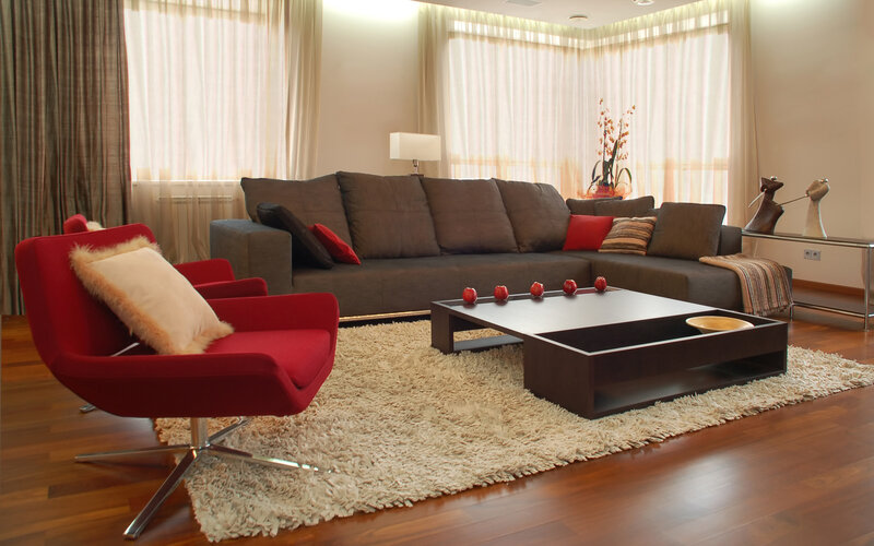 Modern living room with red armchair