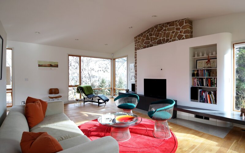Modern living room with red rug