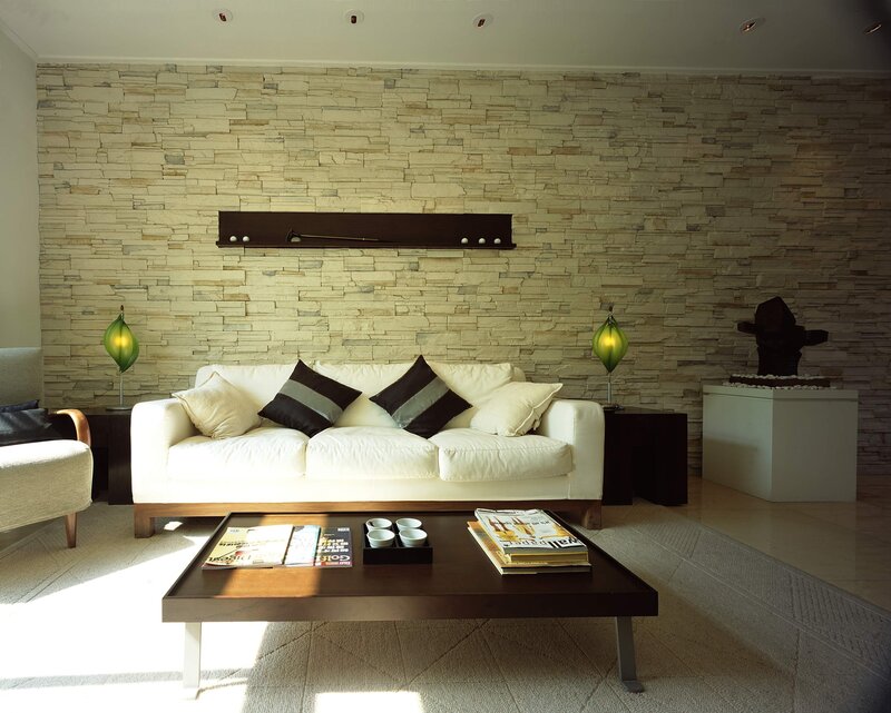 Modern living room with stone wall