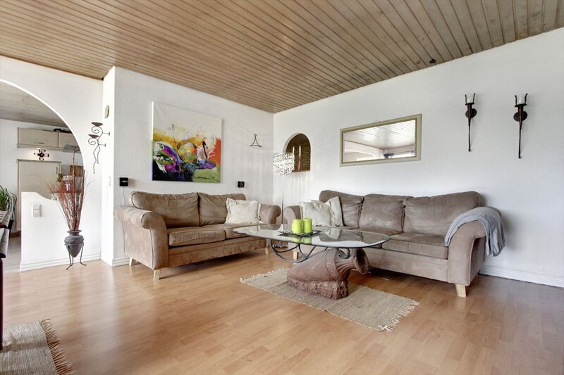 Modern living room with wooden ceiling