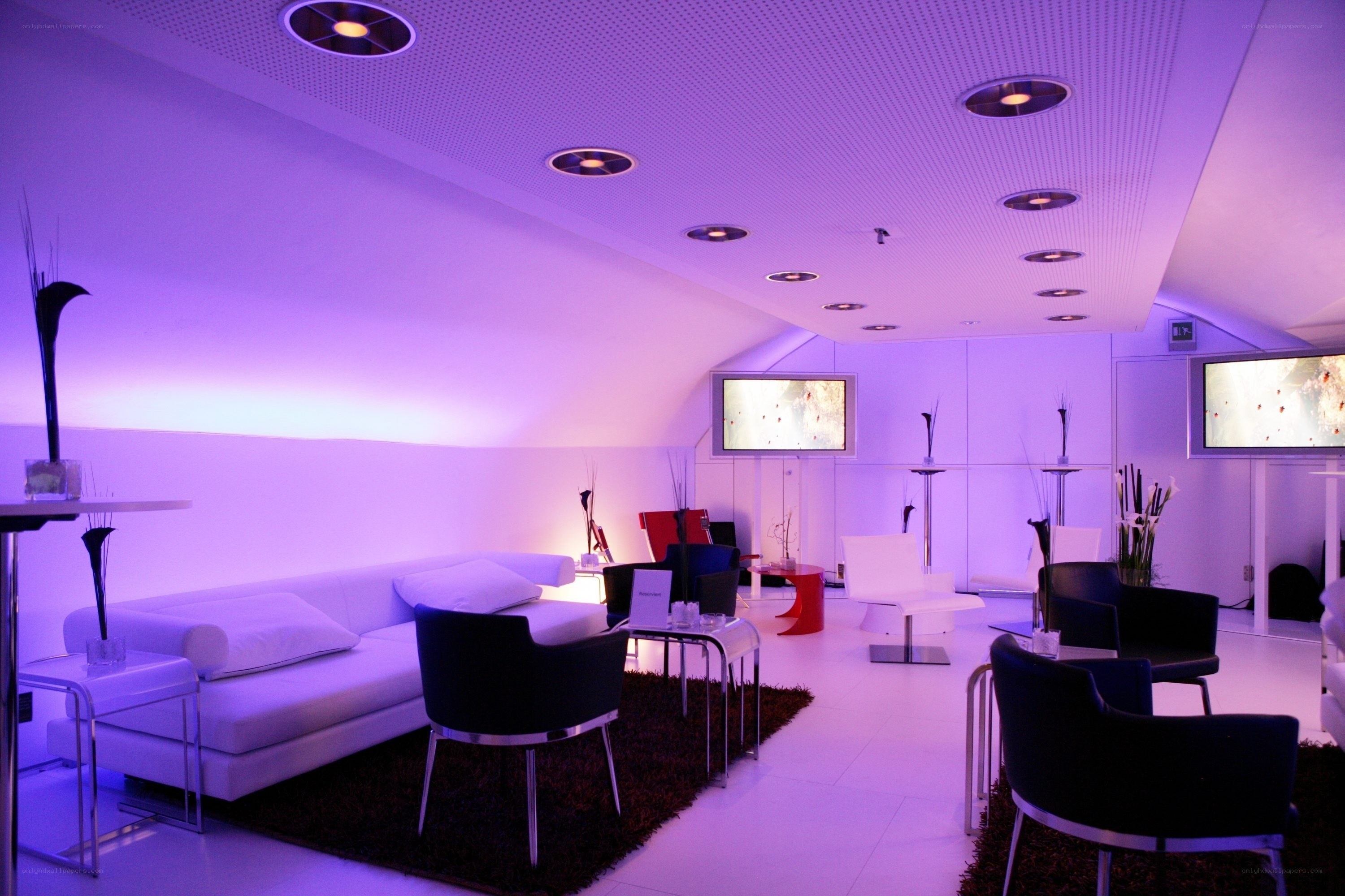 Modern lounge with purple lighting