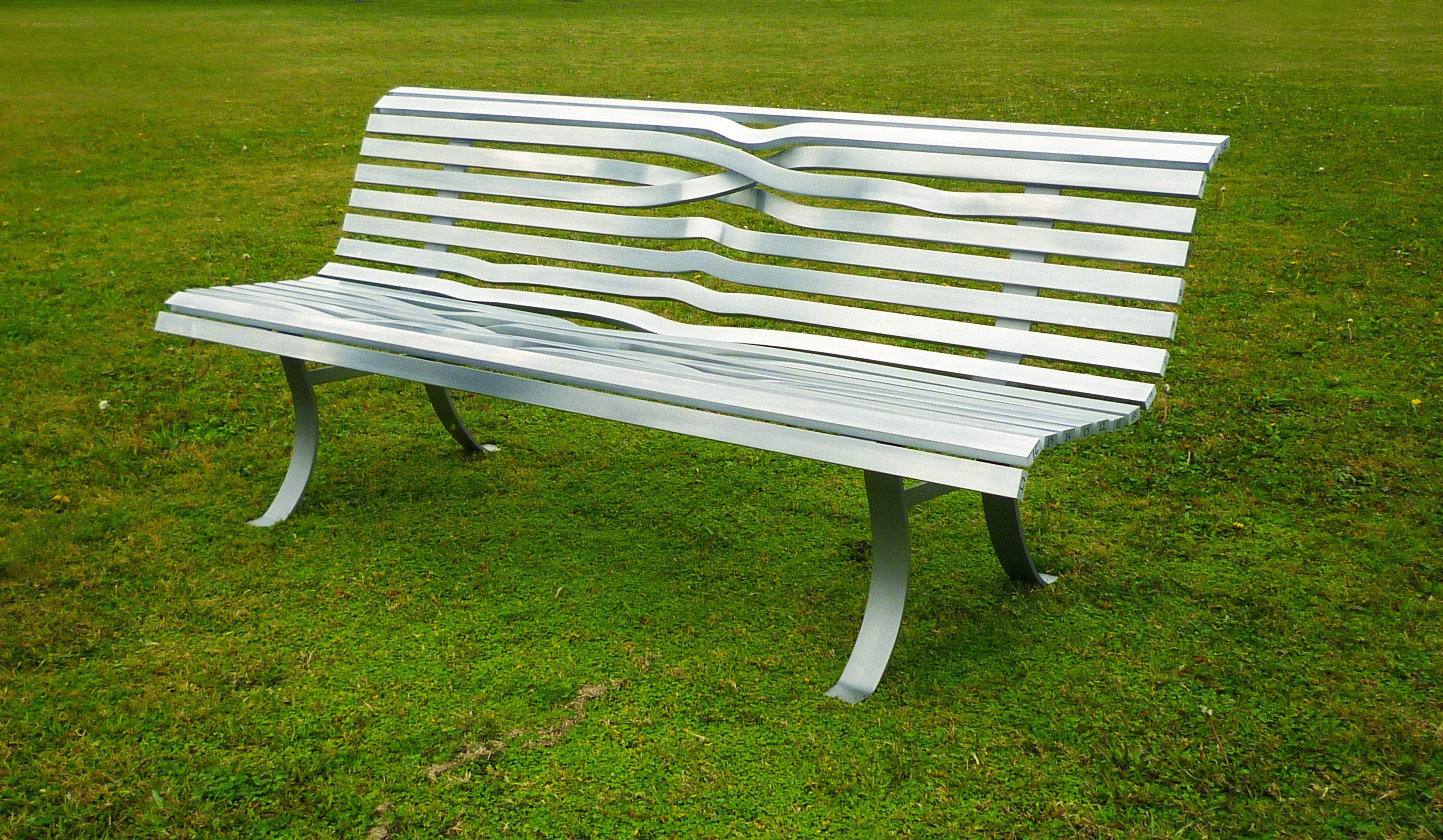 Modern metal bench in park