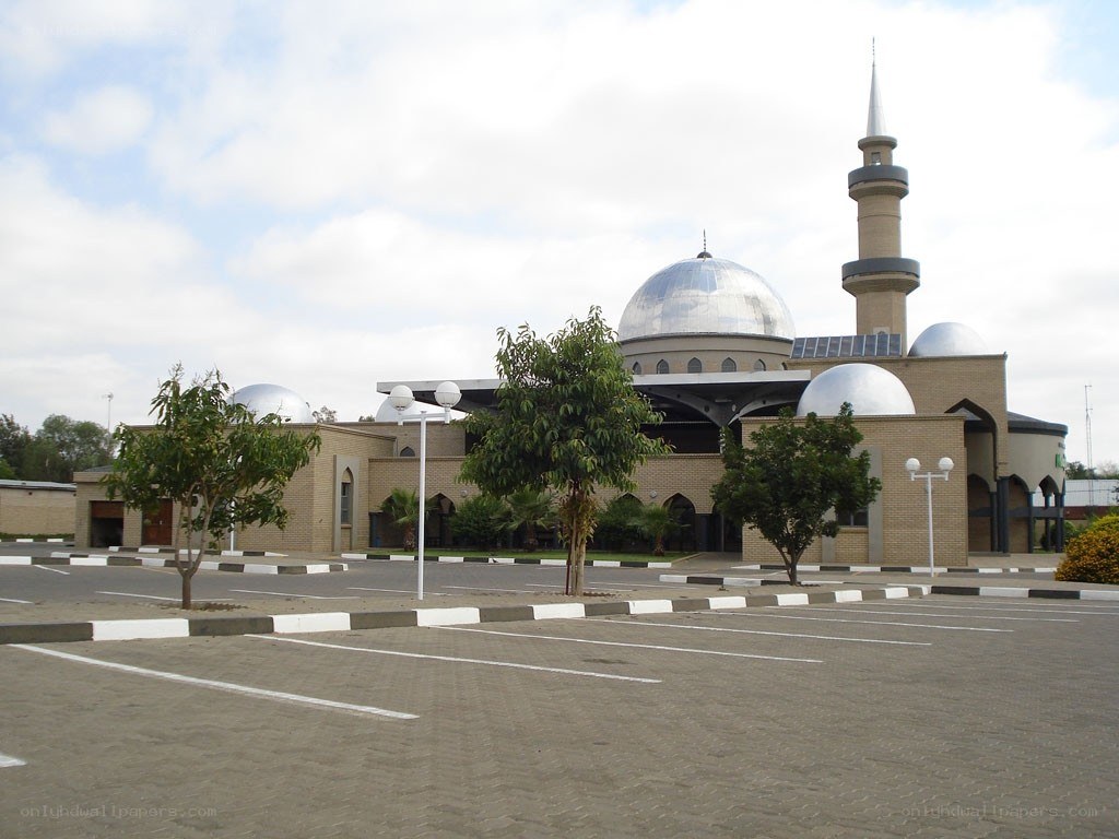 modern mosque with domes and minaret