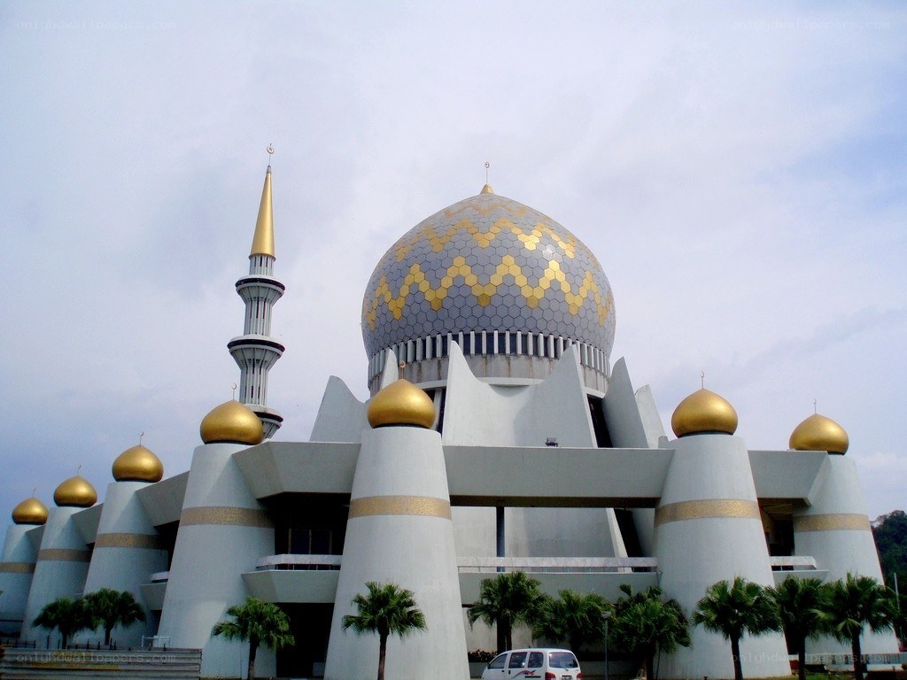 modern mosque with golden domes