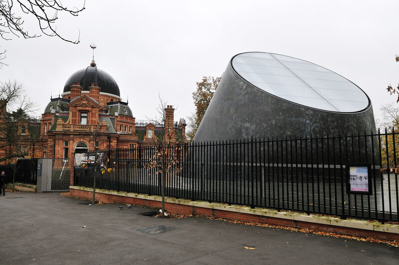 Modern observatory next to historic building
