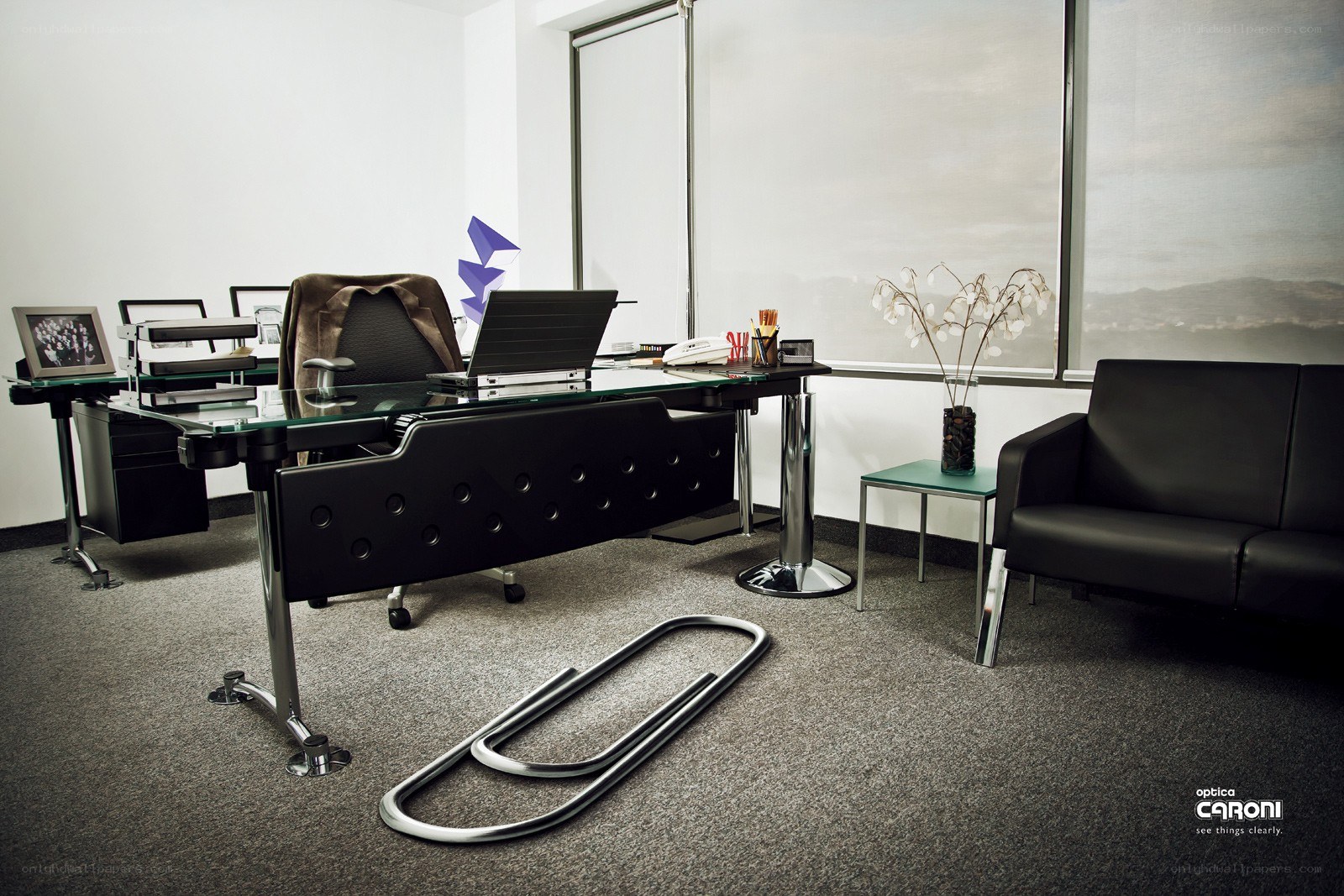 Modern office with giant paperclip