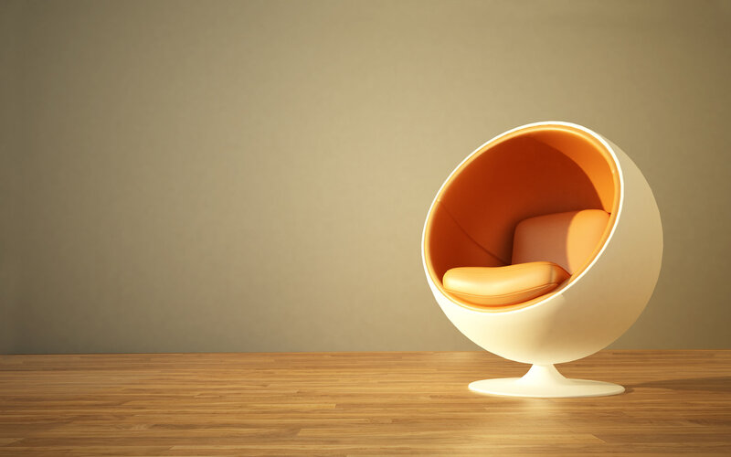 Modern orange chair in minimalist room