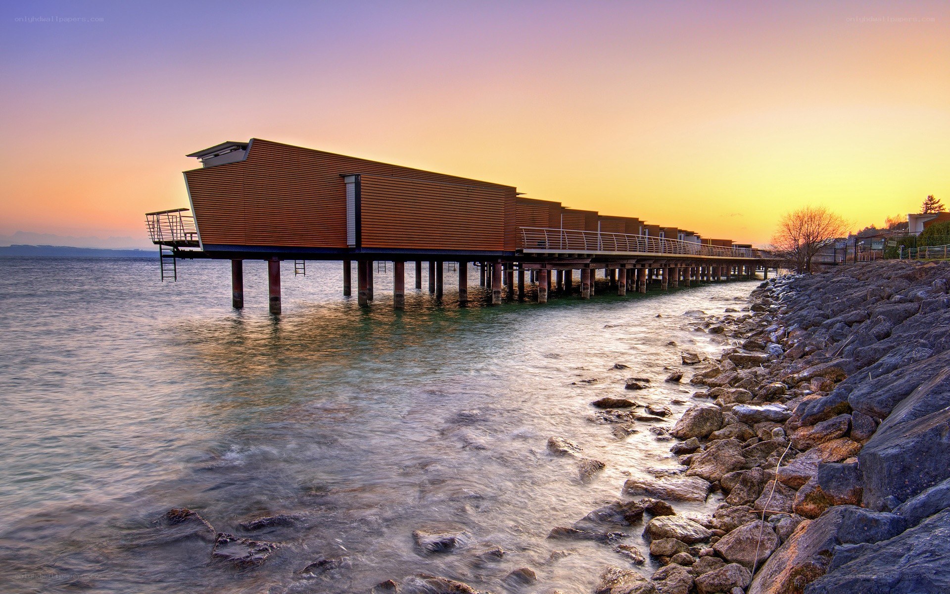 Modern pier house at sunset