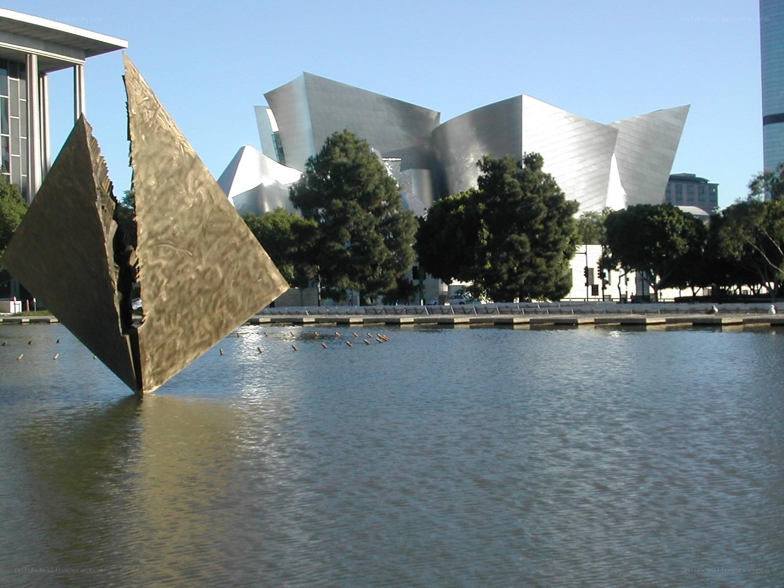 Modern sculpture by water