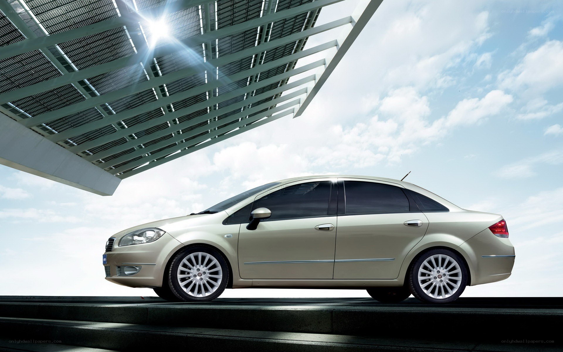 modern sedan under solar canopy