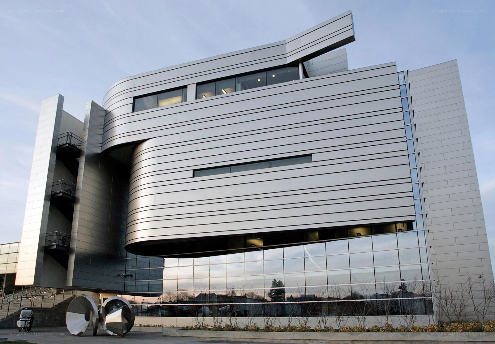 modern silver building with glass facade