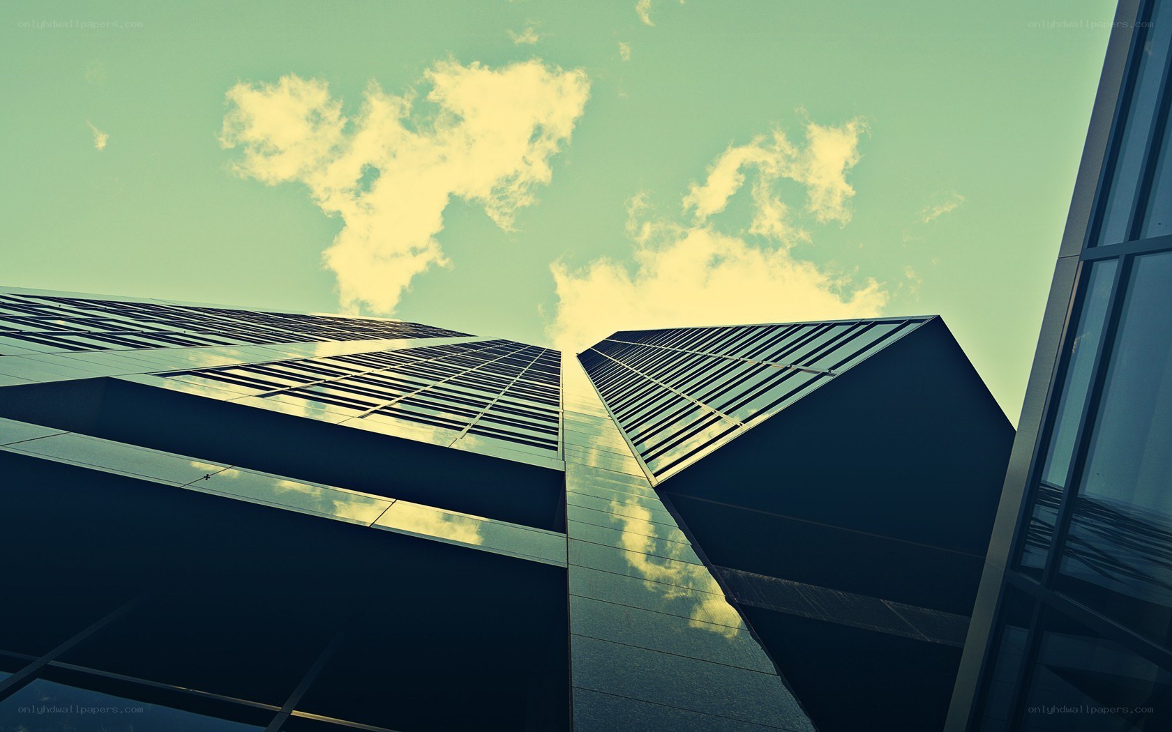 Modern skyscrapers under cloudy sky