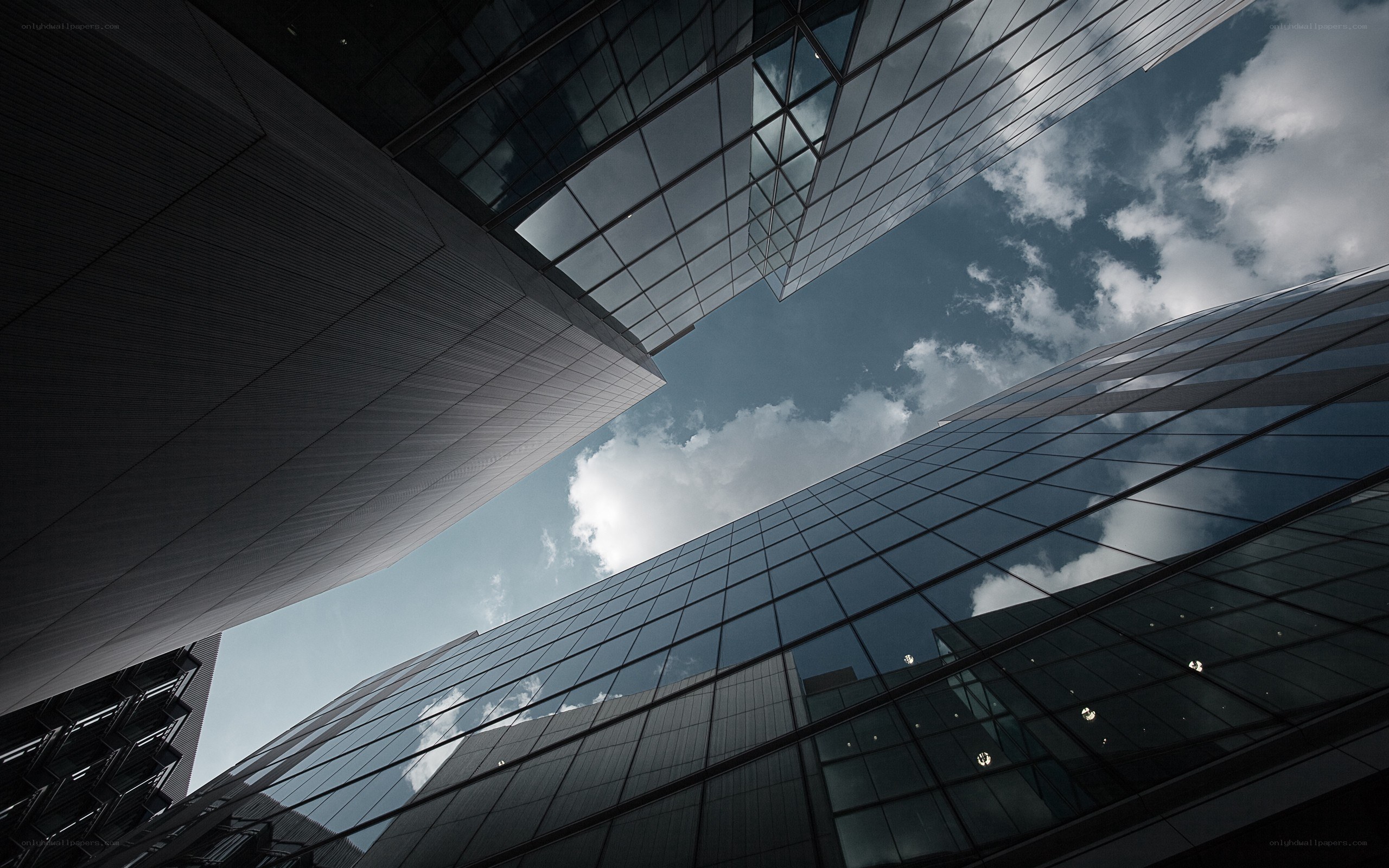 Modern skyscrapers under cloudy sky