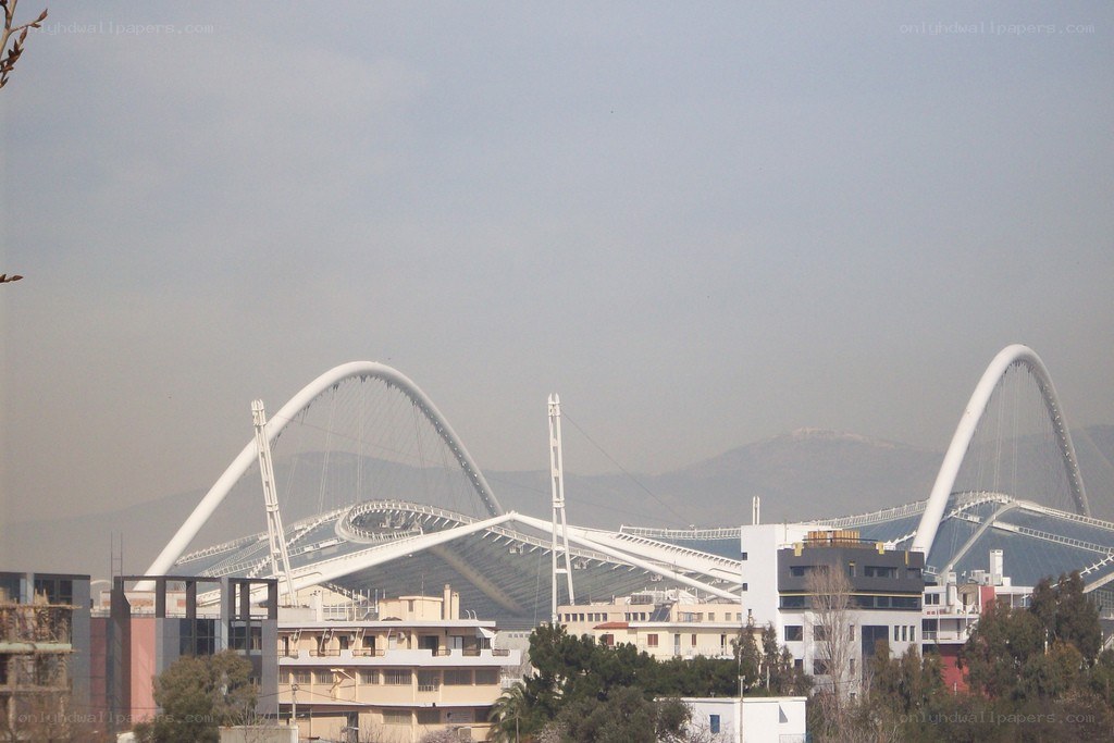Modern stadium with white arches
