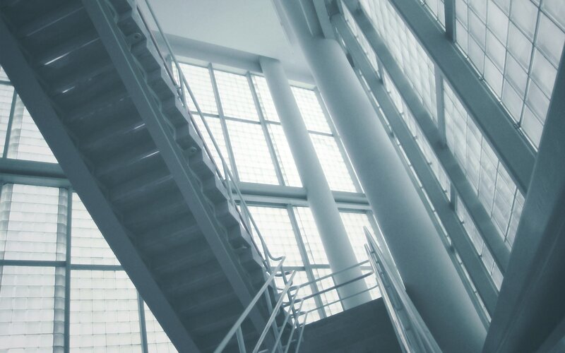 modern staircase with glass block walls
