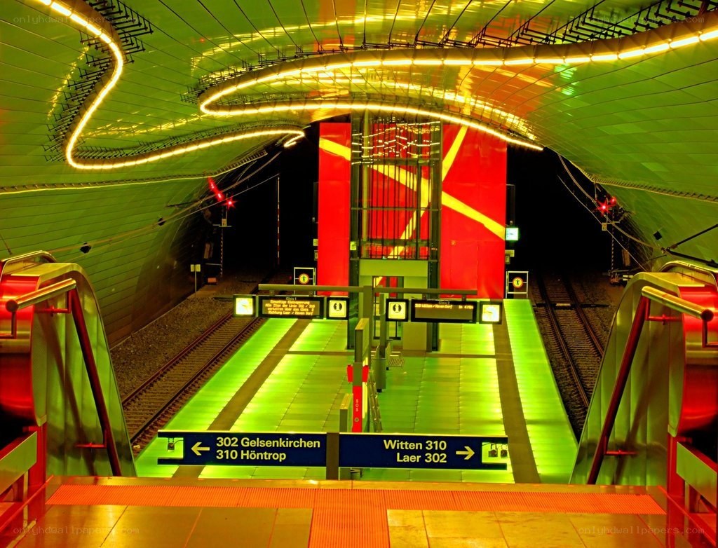 Modern subway station with green lighting