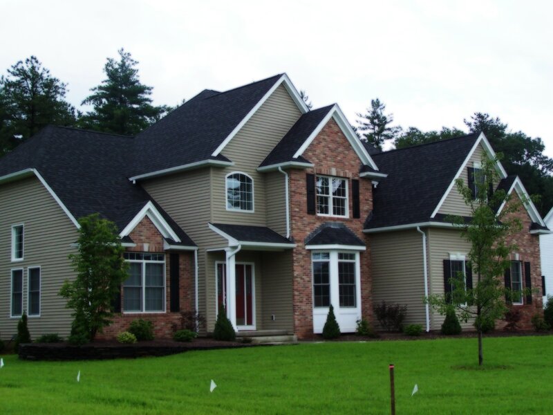modern two-story house with brick accents