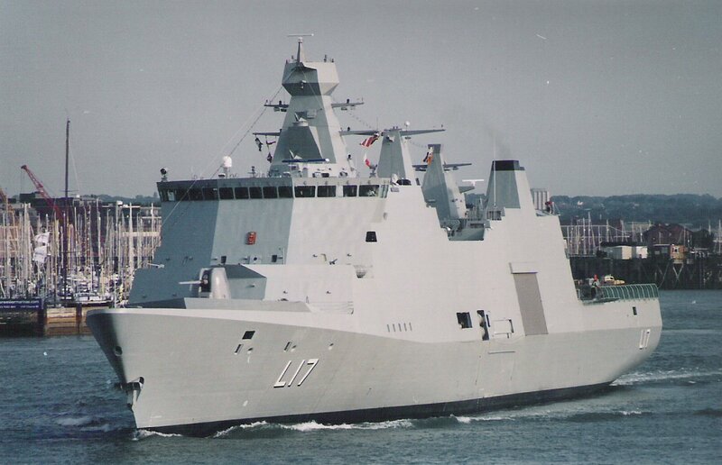 modern warship in harbor