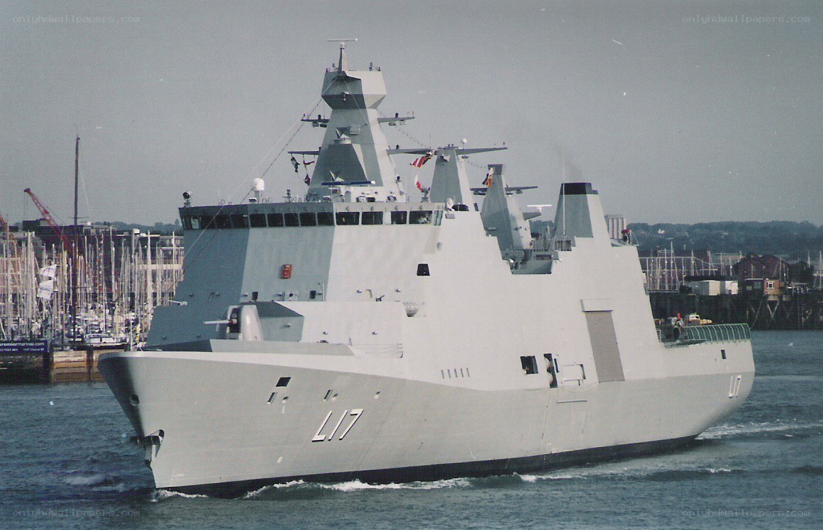modern warship in harbor