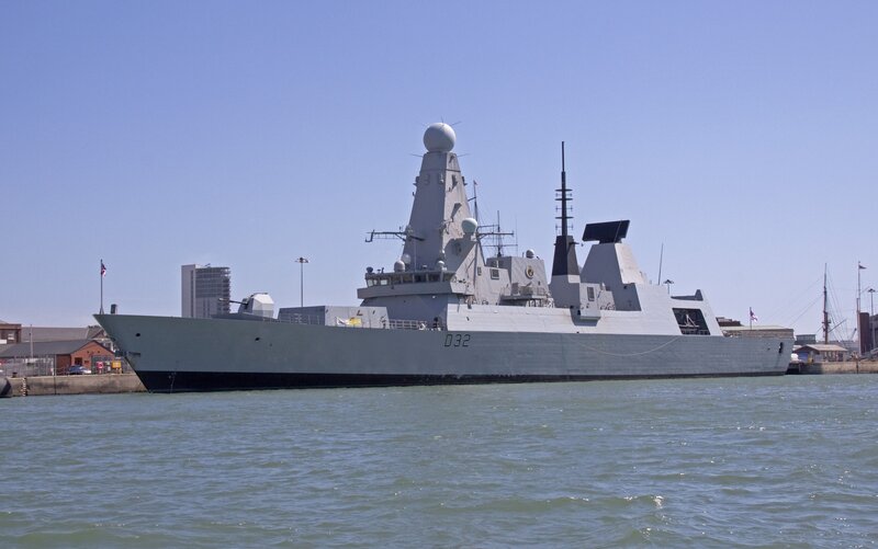 Modern warship in harbor
