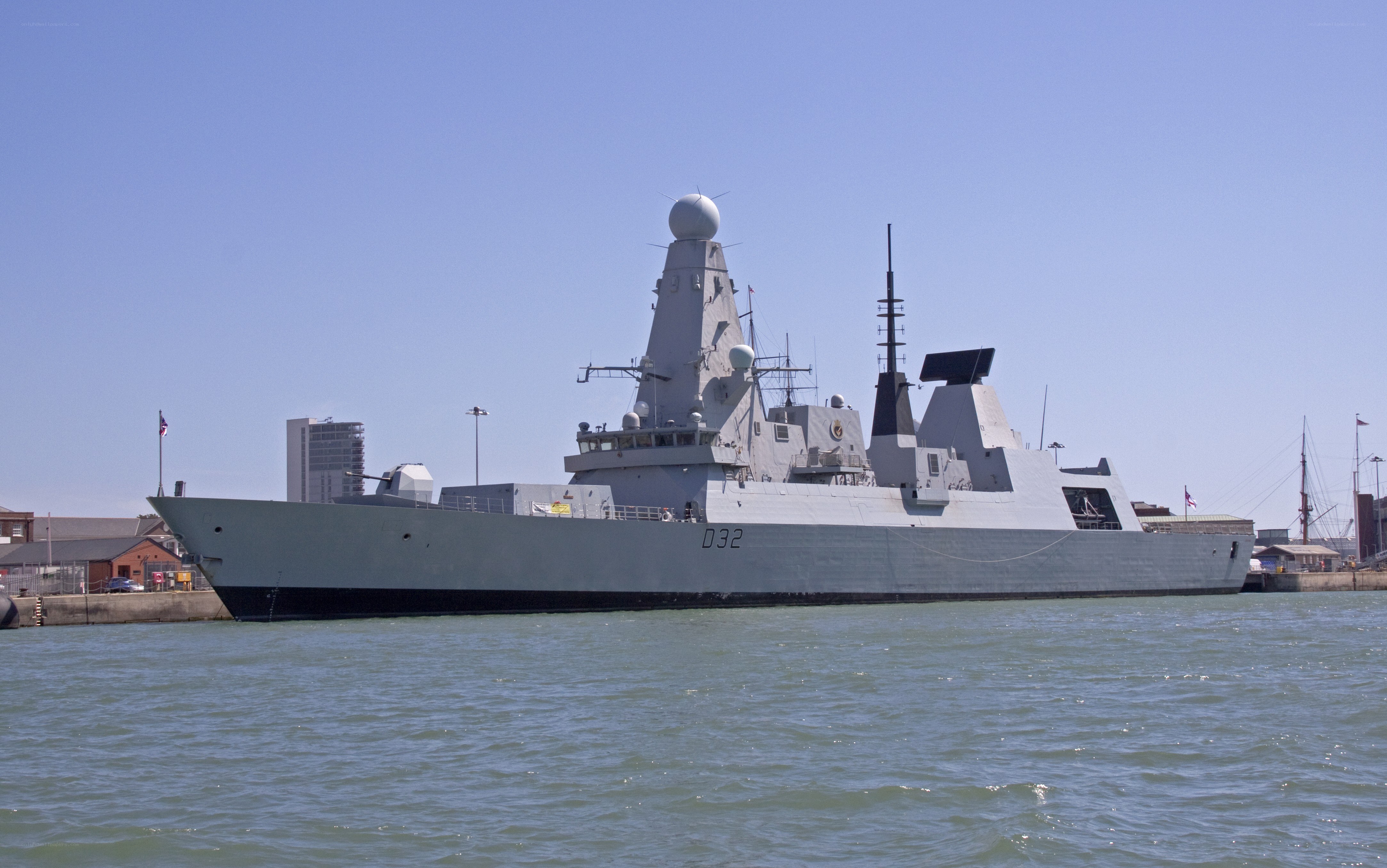 Modern warship in harbor