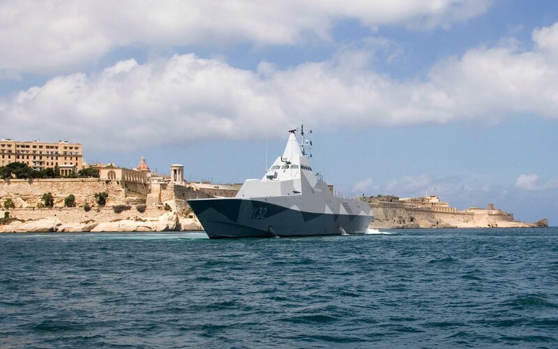Modern Warship in Harbor — Blue
