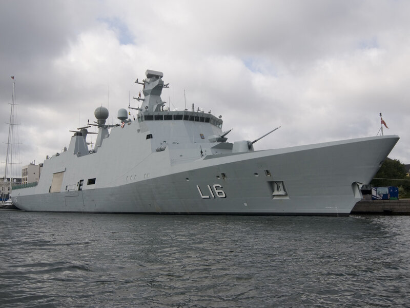 modern warship in harbor