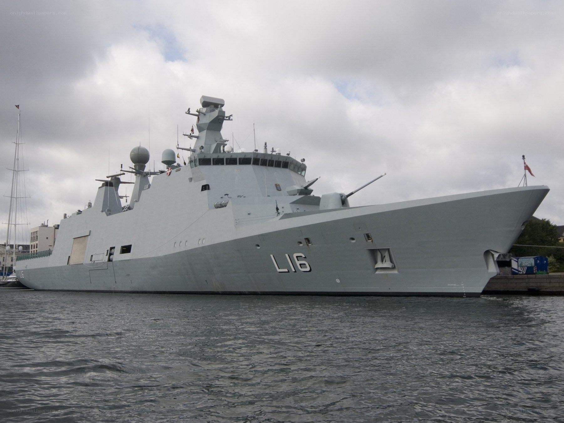 modern warship in harbor