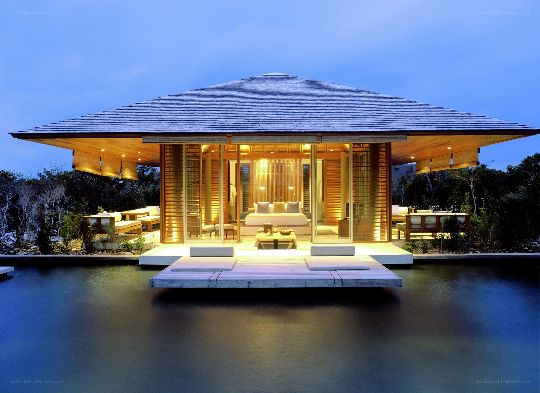 Modern water villa at dusk