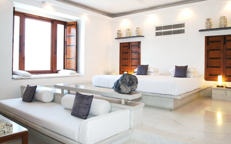 Modern white bedroom with wooden accents