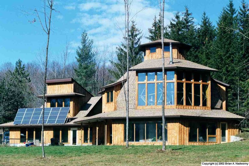 Modern wooden house with solar panels