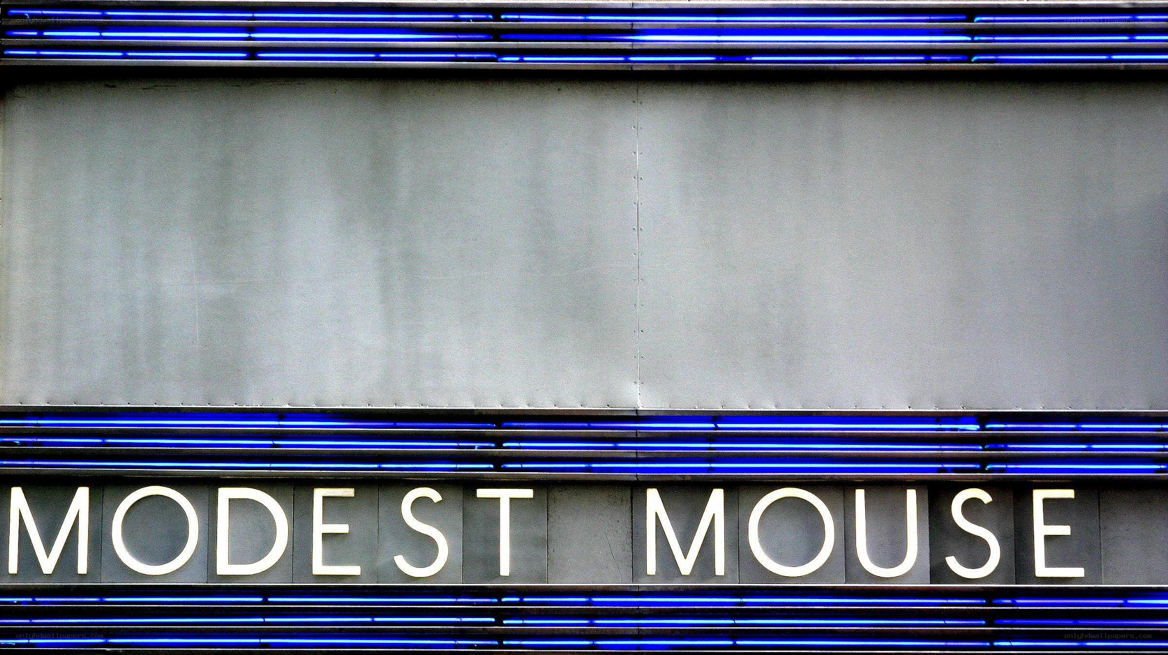 Modest Mouse sign with blue neon