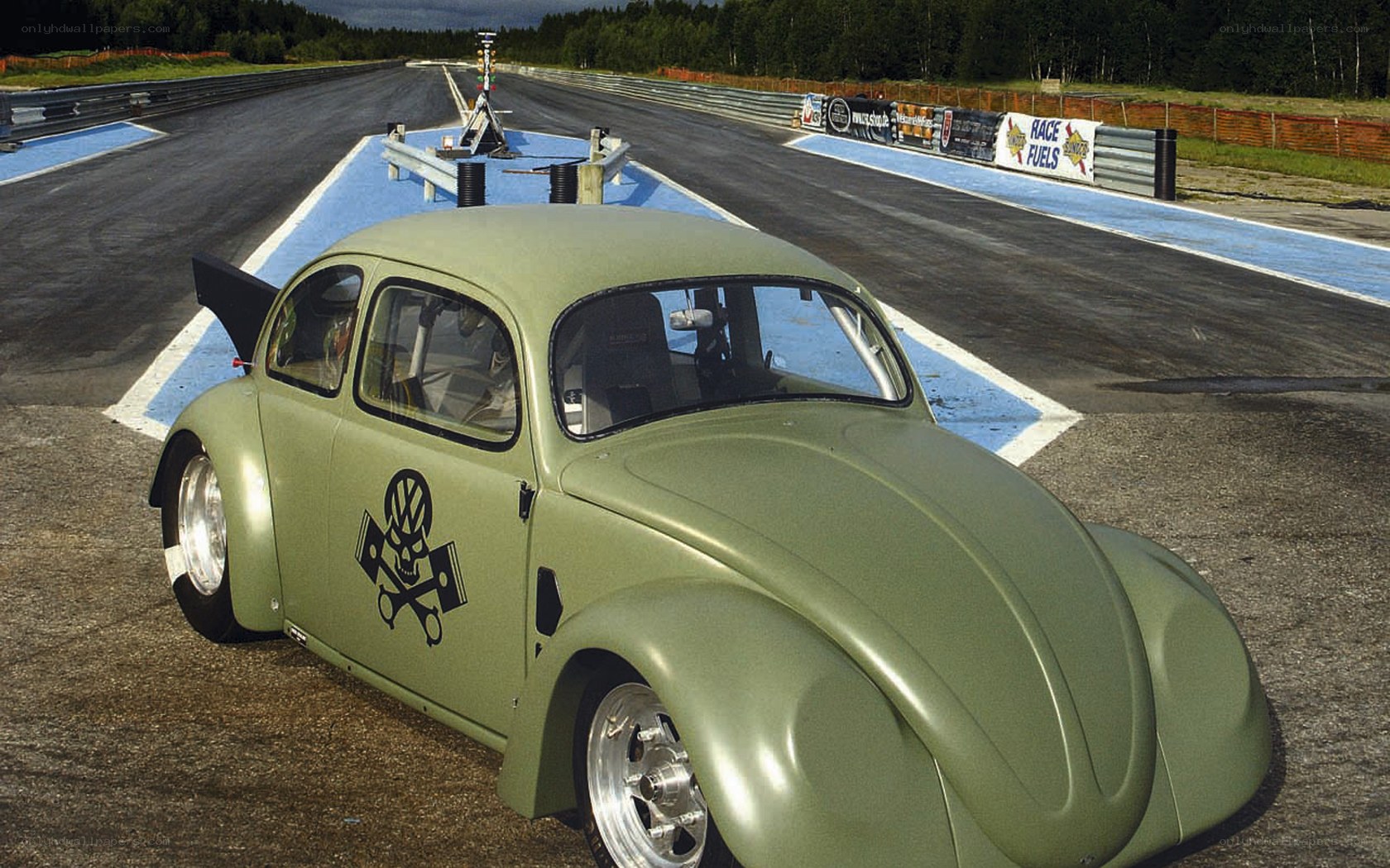 Modified olive green Beetle on track