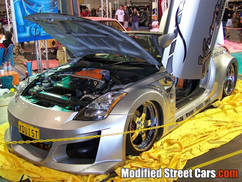 Modified silver sports car on display