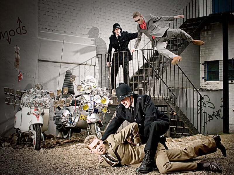 Mods and police in a street scene