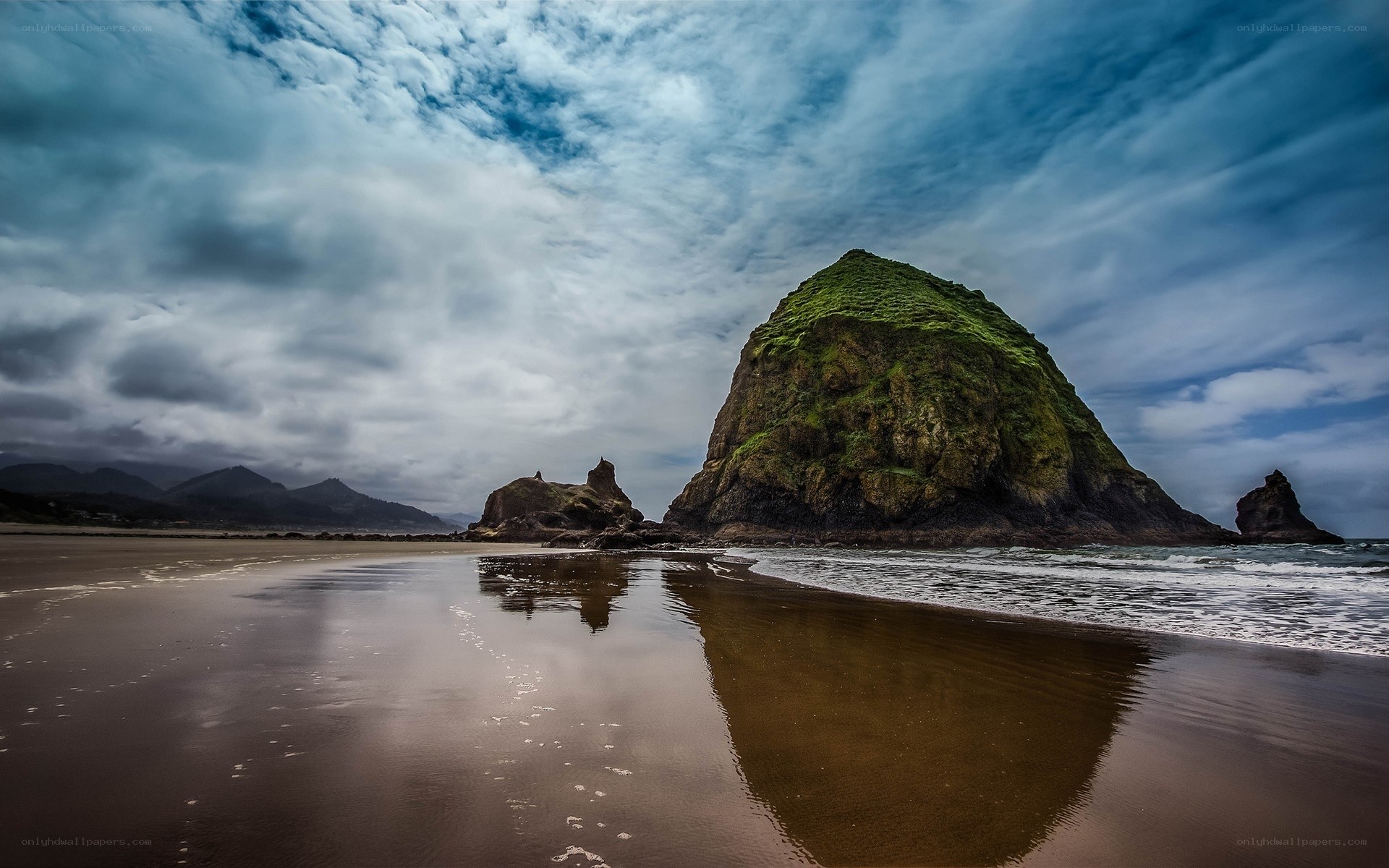 Moist beach with sea stack
