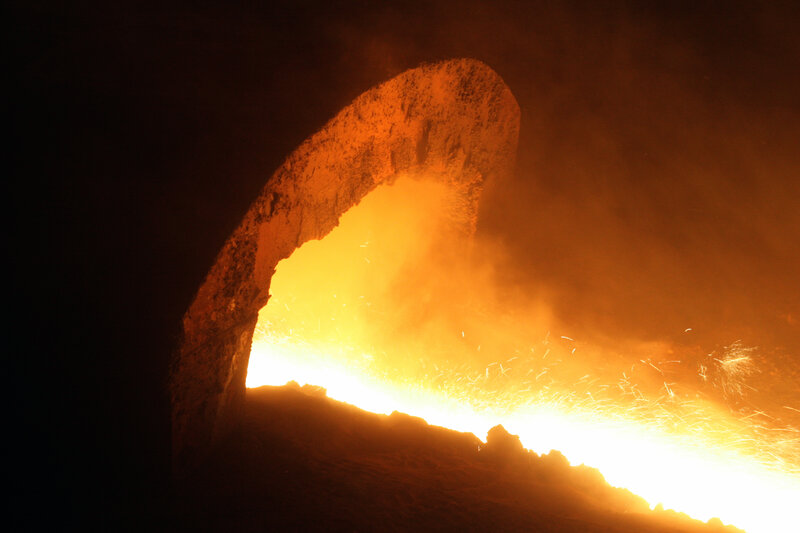 molten metal pouring from furnace