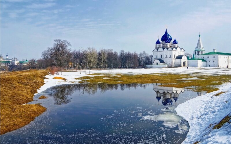 Monastery by a river in winter