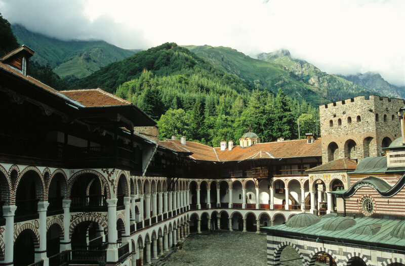 Monastery courtyard with mountains